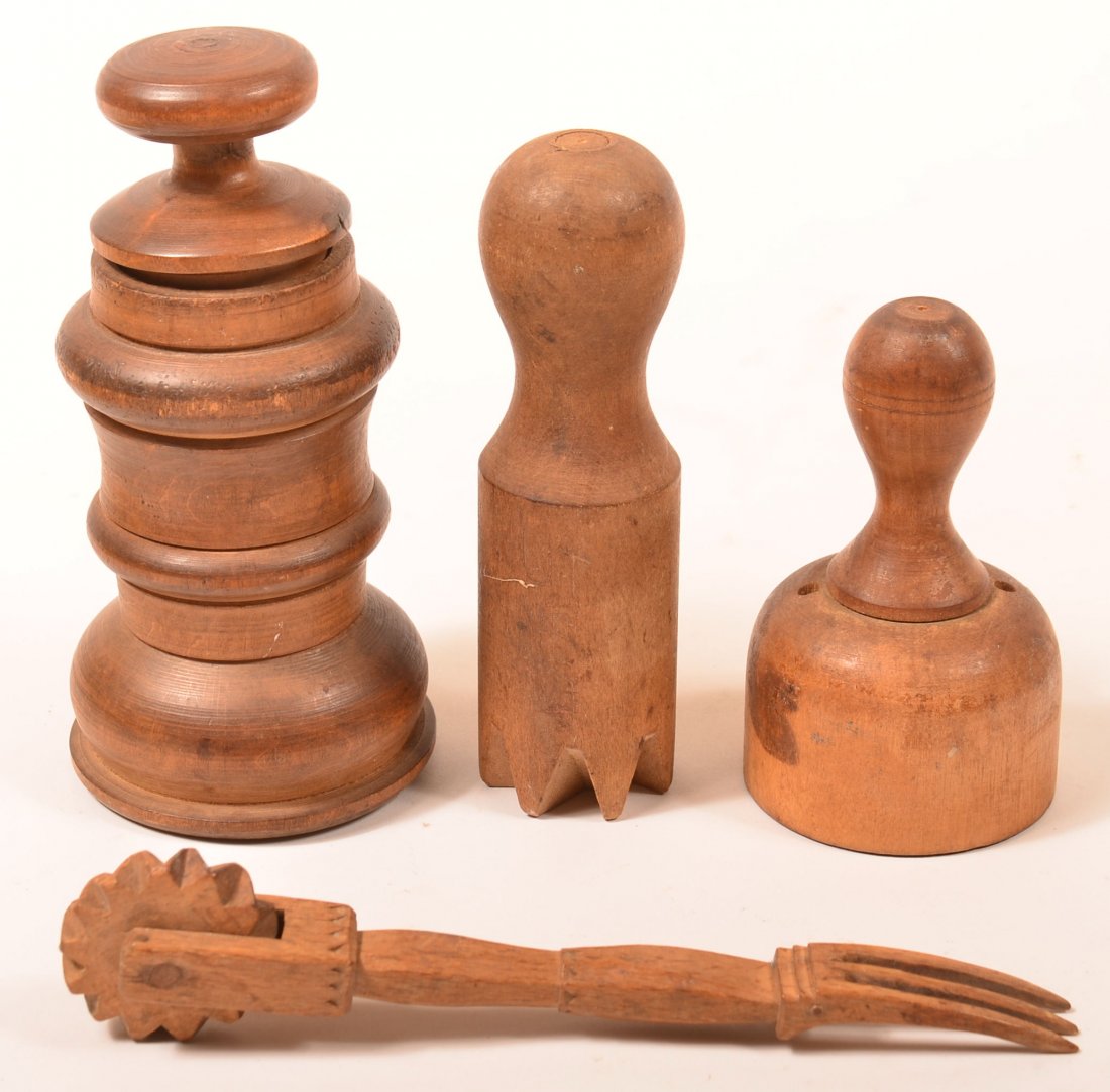 Lot of Four 19th Century Wood Culinary Items. Pie: Lot of Four 19th Century Wood Culinary Items. Pie crimper with fork end, 7-3/4" long, 3 piece turned nutmeg grater, 6-1/2" high, doughnut cutter and juicer. Condition: Very good with minor losses.
