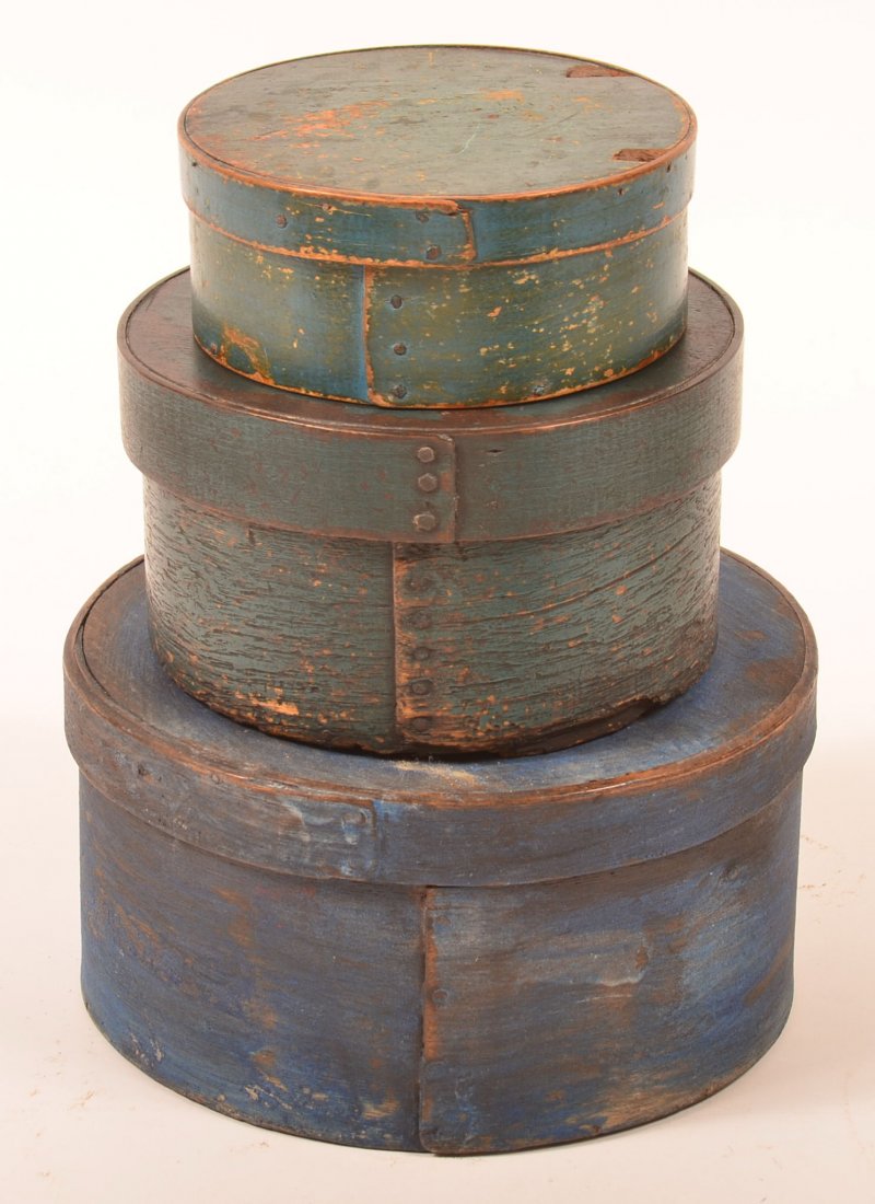 Three 19th Century Round Bentwood Pantry Boxes with: Three 19th Century Round Bentwood Pantry Boxes with Blue Paint. Over lapped joints with iron tack supports. 2-1/2"h. x 6"diam., 4-1/4"h. x 7-1/2" diam. and 4-3/4" x 9-1/4". Condition: Fair good with s