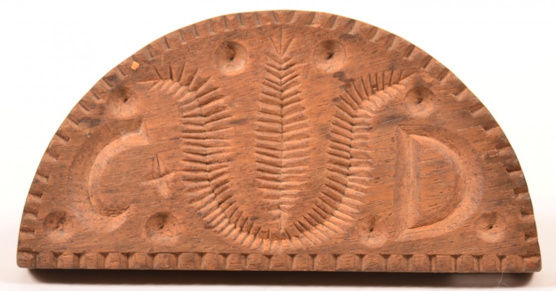 19th Century Walnut Half Round Butter Print: 19th Century Walnut Half Round Butter Print withStylized Tulip and Initials "C.D.". With long friction fit handle. 3-3/4"h. 6-3/4"w. Condition: Very good with minor wear.