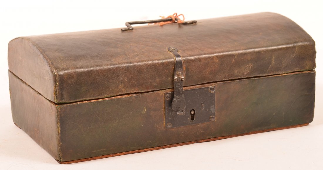 Late 18th/Early 19th Century Leather Covered Softwood: Late 18th/Early 19th Century Leather Covered Softwood Dome Lid Document Box. Iron handle and lock with newspaper lining. 4-1/4"h. x 11-3/4"w. x 6-3/8"d. Condition: Very good with minor wear.