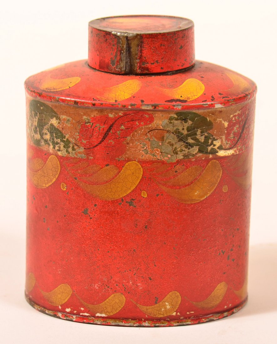 19th Century Red Ground Toleware Tin Tea Caddy. Oval: 19th Century Red Ground Toleware Tin Tea Caddy. Oval body with yellow swag decorations on red ground. 4-1/4"h. Condition: Very good with paint loss.