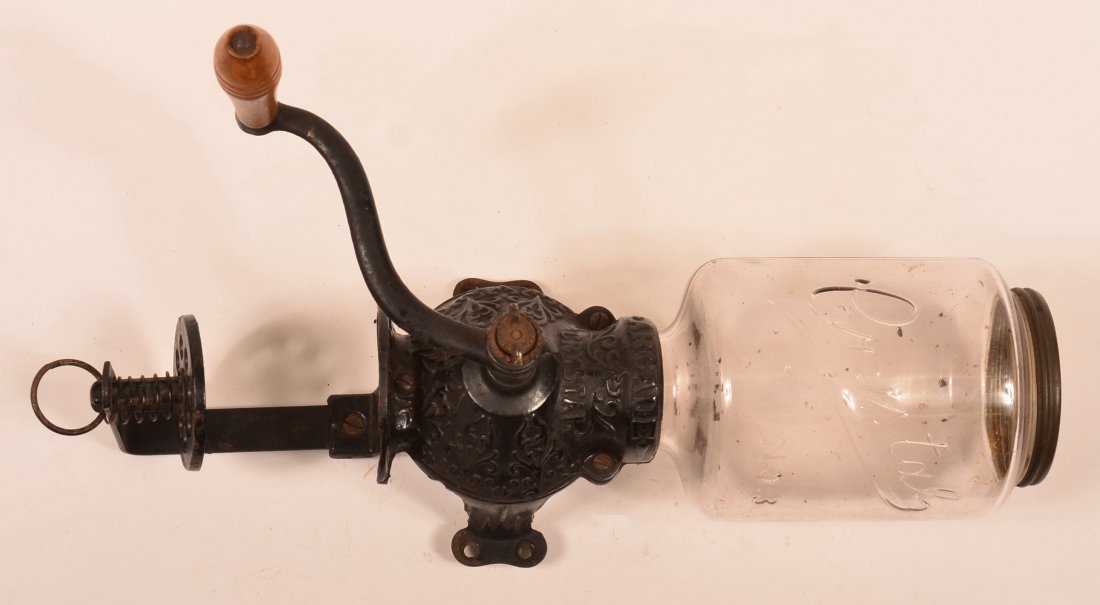 Arcade Crystal No. 3 Wall Coffee Grinder. Cast iron: Arcade Crystal No. 3 Wall Coffee Grinder. Cast iron frame with original glass jar and tin lid. 17"h. Condition: Good.