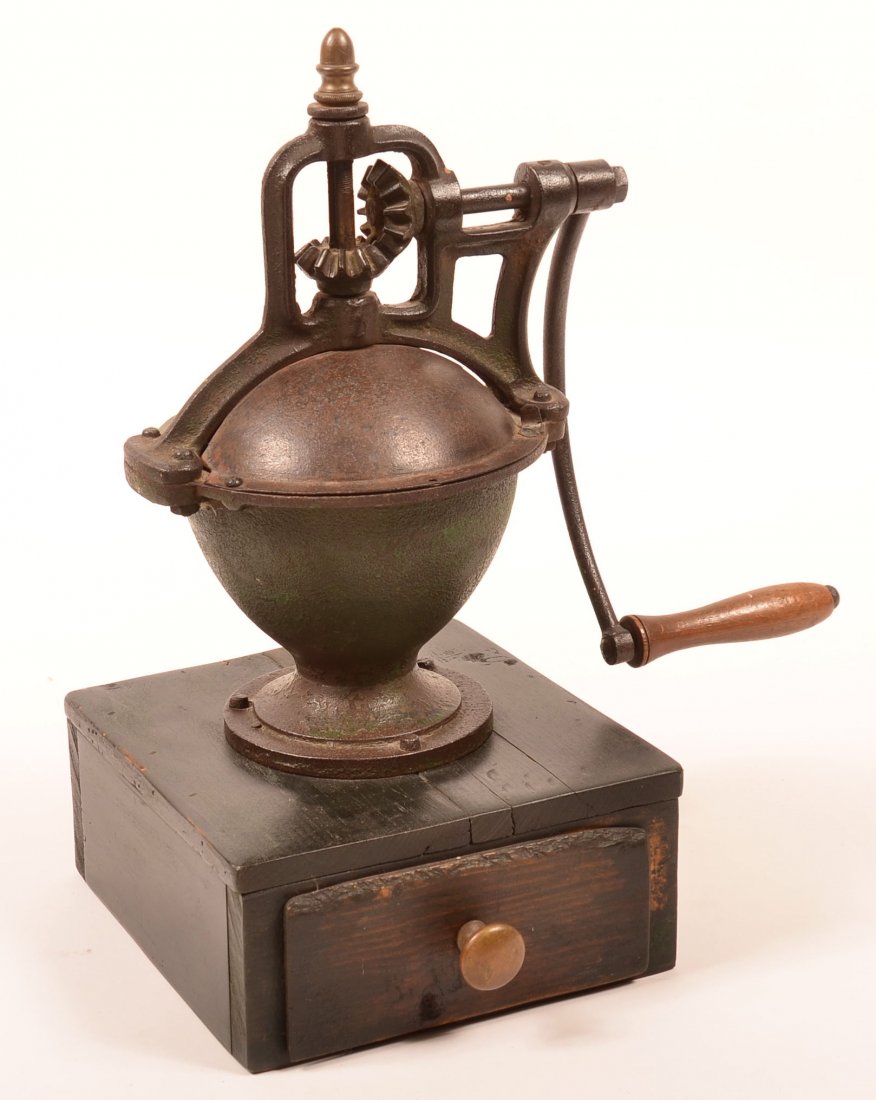 Cast Iron Table Top Coffee Mill. Wooden base with: Cast Iron Table Top Coffee Mill. Wooden base with drawer.( possibly French), 17-1/4"h. Condition: Good.