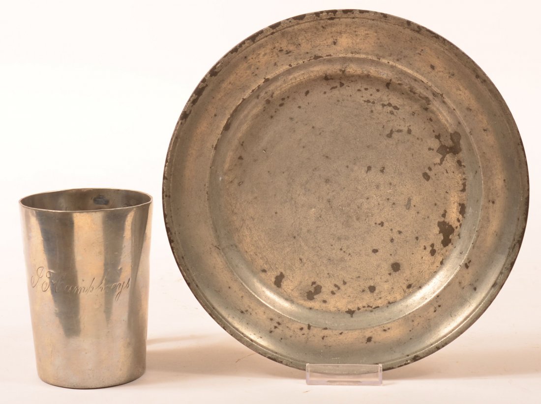 Lot of Two Pieces of Pewter. J Humphrey script handle: Lot of Two Pieces of Pewter. J Humphrey script handle mug, marked with a crown above VR, 4-3/4"h. 9-1/2"dia. Plate marked three times with hallmarks Ellis-Bey-Bach with angel balance scale, stag, Bi_,