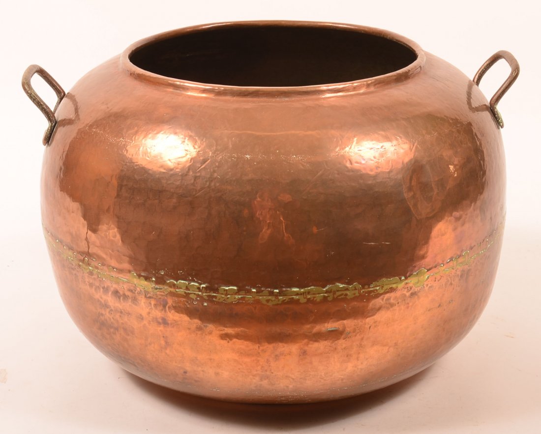 Large Hammered Copper Pot. Circular form with dovetail: Large Hammered Copper Pot. Circular form with dovetail seams and handles, 13-1/4"h. x 20-1/4"dia. Condition: Good.