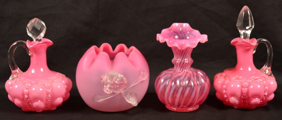 Four Pieces of Cranberry Victorian Art Glass. Two: Four Pieces of Cranberry Victorian Art Glass. Two Cruets, 6-1/2"h. and 6-1/4"h.; Crimped top rose bowl with applied floral decoration, 3-1/2"h; Jack-in-the-pulpit opalescent vase, 5"h. Condition: Good