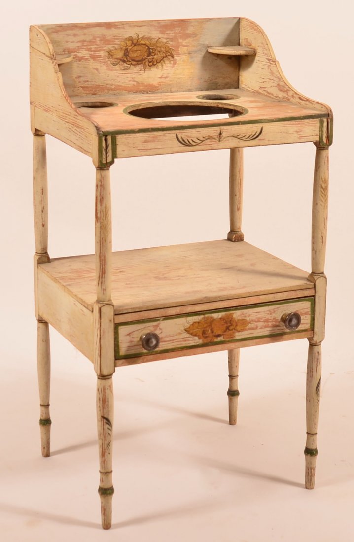 New York Sheraton Painted Softwood Basin Stand. Splash: New York Sheraton Painted Softwood Basin Stand. Splash back with corner candle shelves, three cut out receptacles above a lower shelf with full width dovetailed skirt drawer and turned legs. 37"h. x 1