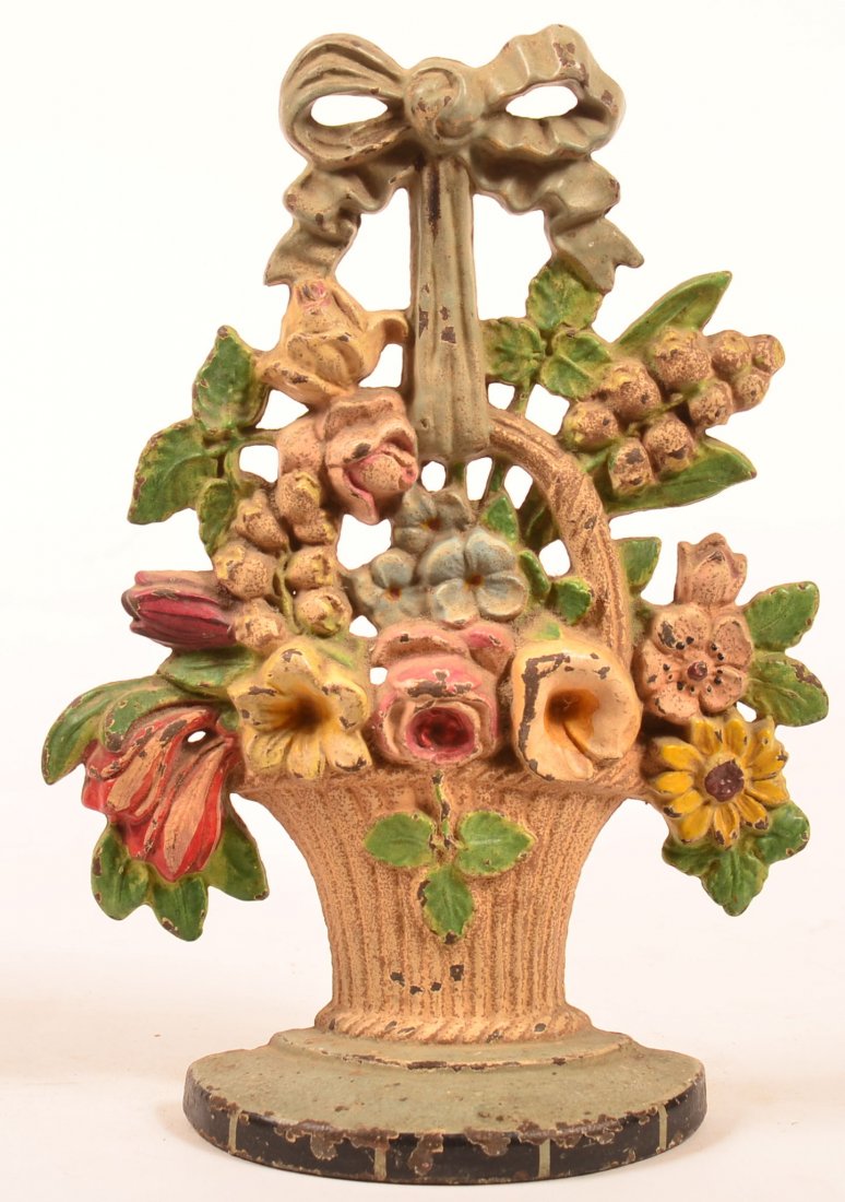 Hubley Design 189 Lily of the Valley Cast Iron Basket: Hubley Design 189 Lily of the Valley Cast Iron Basket of Flowers Doorstop. Original polychrome painted decoration. 10-1/4"h. Condition: Good, paint wear.
