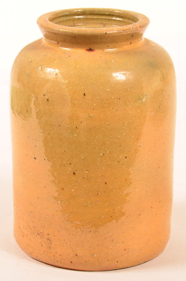 Yellow to Light Green Glazed Redware Canning Jar: Yellow to Light Green Glazed Redware Canning Jar Stamped "John Bell" on Base. Straight sided with rolled shoulders and flared spout. 7-1/2"h. Condition: Very good, missing lid.