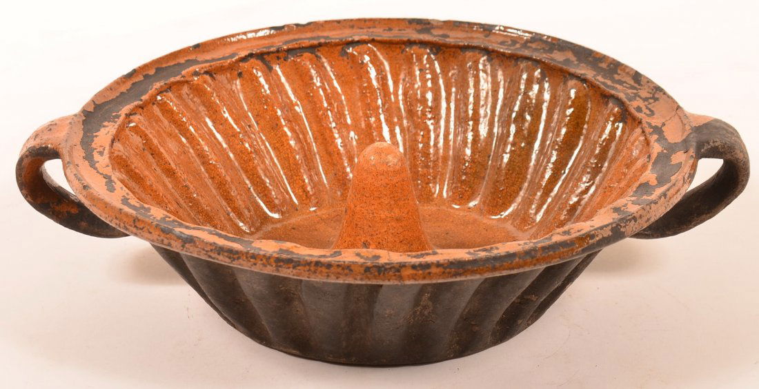 Interior Glazed Redware Turks Mold with Loop Handles: Interior Glazed Redware Turks Mold with Loop Handles probably French. 15 1/2" diam. Condition: Good, with few hairlines.