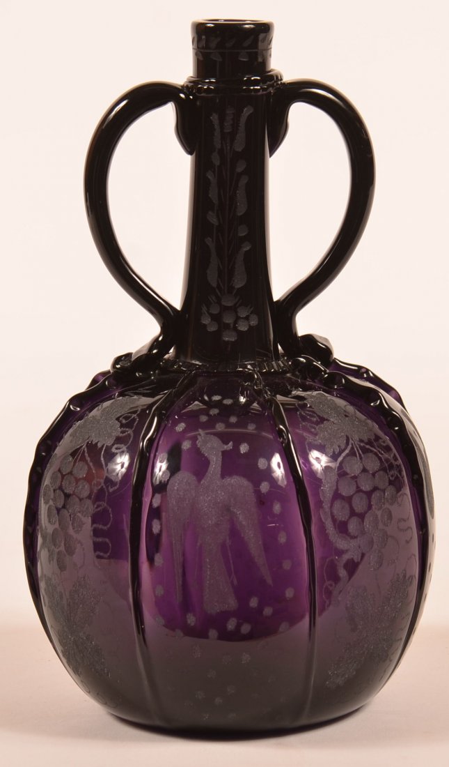 Blown Deep Amethyst Glass Decanter with Wheel Engraved: Blown Deep Amethyst Glass Decanter with Wheel Engraved Decoration. Neck ring, applied handles, applied ribs having alternating reserves of bird and grape design. 8-3/4"h. Condition: Very good.