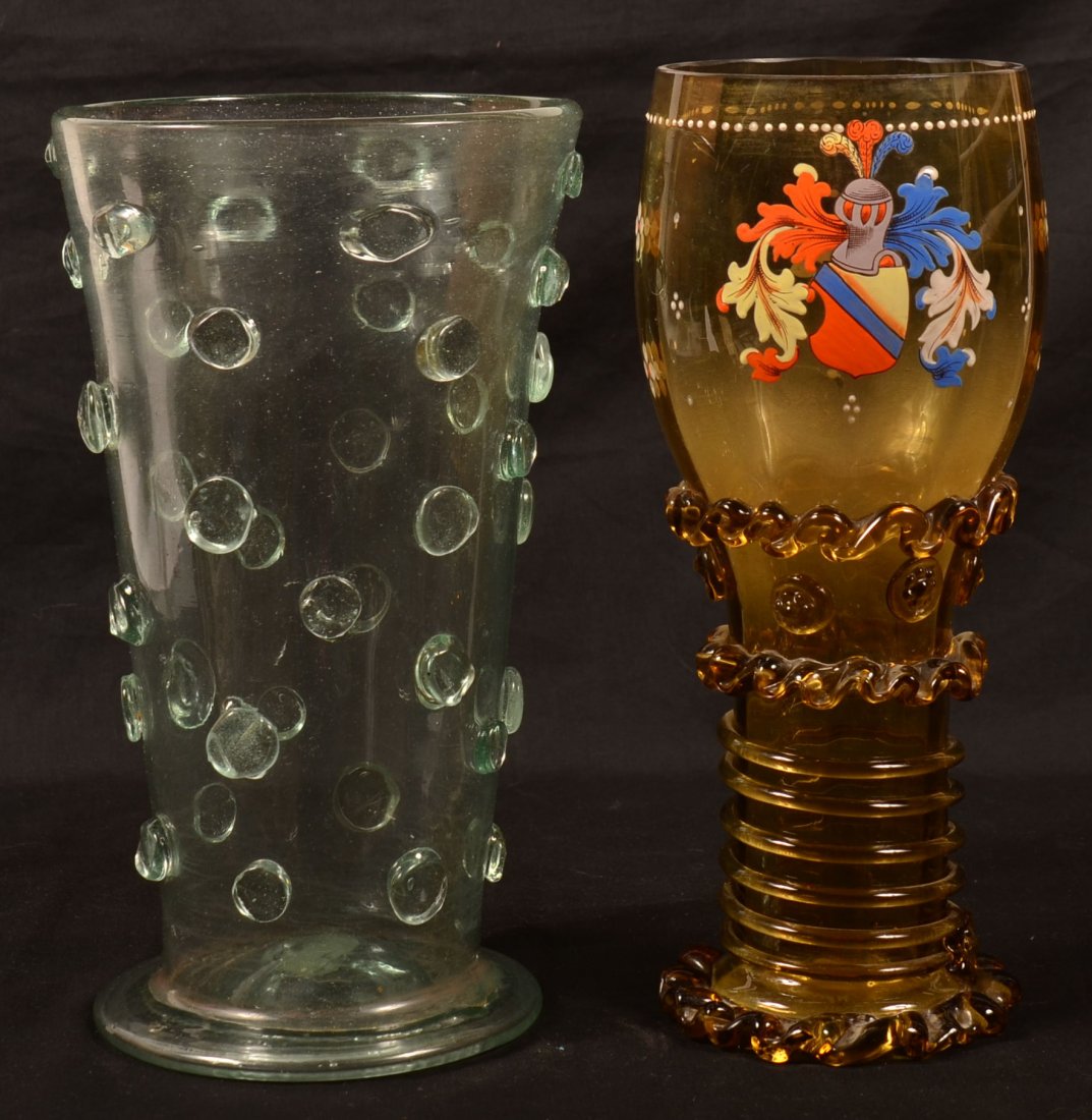 Two 19th Century Blown Glass Vases. 1st: Boheimian: Two 19th Century Blown Glass Vases. 1st: Boheimian amber glass chalice vase with enamel decorated armorial coat of arms, 11" high. 2nd: Aquamarine glass flared top vase with applied disk design, 10-5/