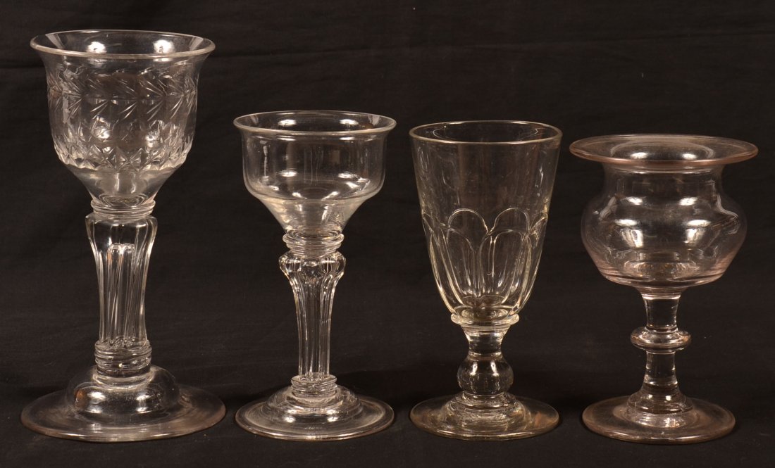 Four Various Blown Colorless Flint Glass Chalices. 6": Four Various Blown Colorless Flint Glass Chalices. 6" to 8-1/4"h. Condition: Good.