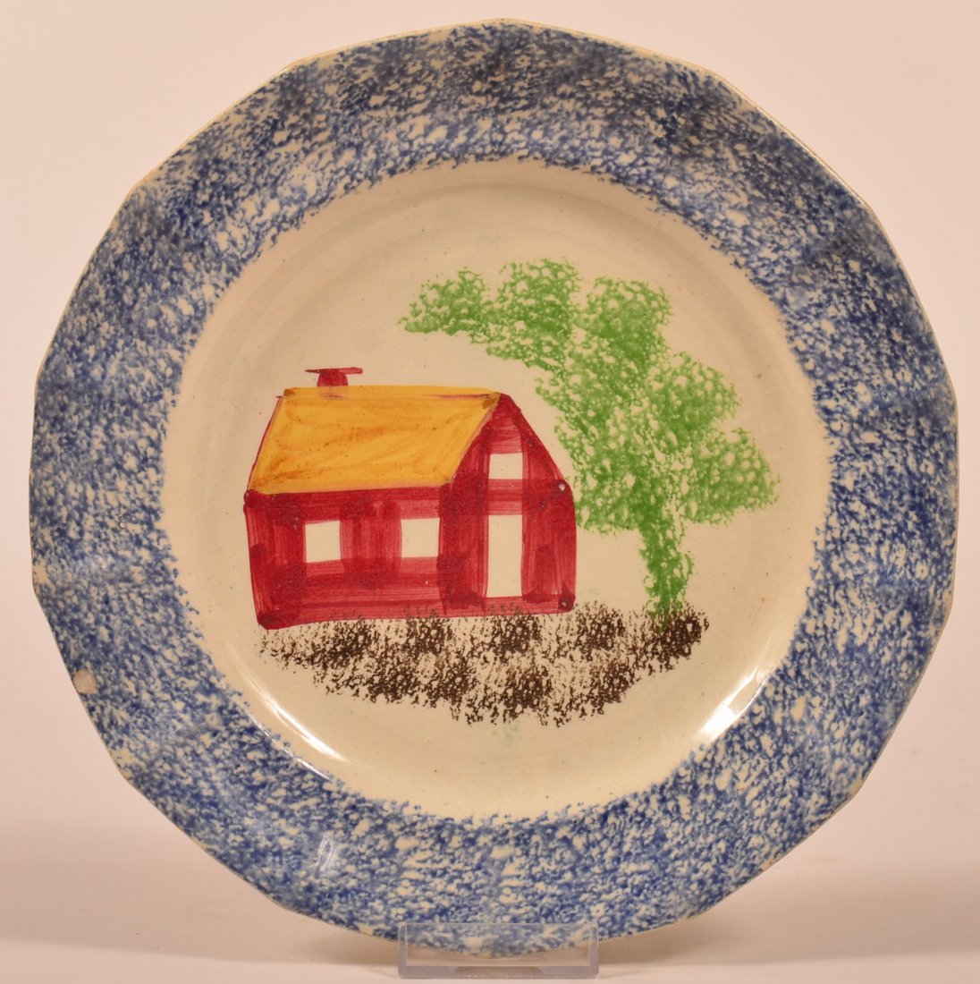 Blue Spatter Ironstone China School House Pattern: Blue Spatter Ironstone China School House Pattern Paneled Plate. Red school house with yellow roof, green tree and brown foreground. 9-1/4" diam. Condition: Good with one edge chip.