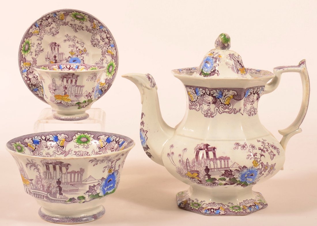 Three Pieces of Purple Transfer Cleopatra Pattern: Three Pieces of Purple Transfer Cleopatra Pattern Ironstone China. 9" Coffee Pot, 6-5/8" diam. Waste bowl, Handless cup and saucer. Condition: Very good.