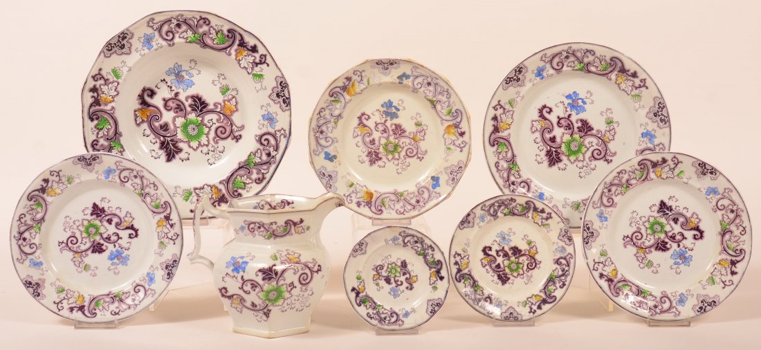 Eight Pieces of Purple Transfer Aurora Pattern: Eight Pieces of Purple Transfer Aurora Pattern Ironstone China. 6-1/2" milk pitcher, various plates measuring 5" to 10-1/4". Condition: Good.