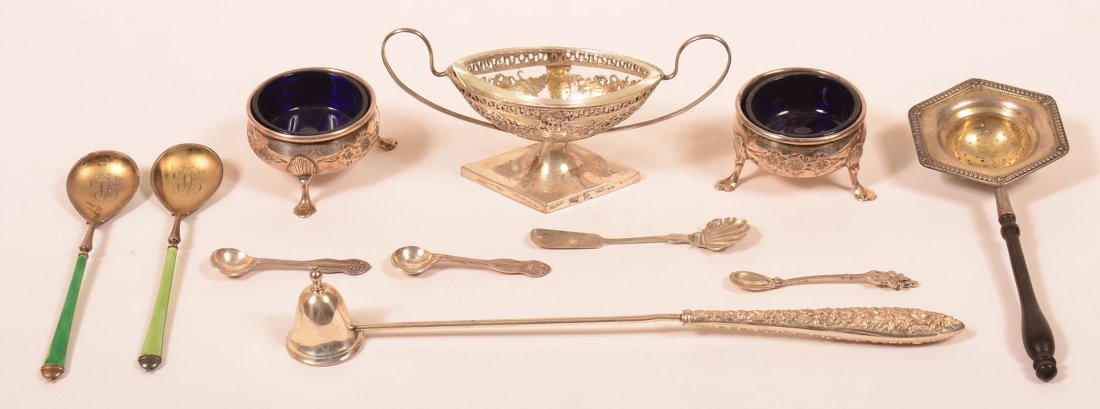Group of American and English Sterling Silver Items.: Group of American and English Sterling Silver Items. Including footed mastersalts, tea strainer, candle snuffer, enamel spoons. 9.0 troy ozs. Gross (not including glass liners). Condition: Good, minor