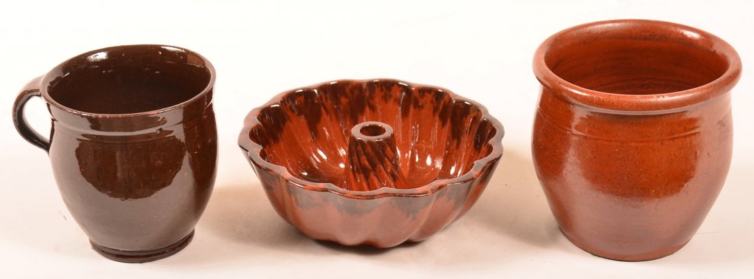 Three Pieces of 19th Century Pennsylvania Glazed: Three Pieces of 19th Century Pennsylvania Glazed Redware Pottery. 1st: Sponge Turk's head mold 7-1/4"" diam. 2nd: Bulbous form apple butter crock, 4-3/4"h. 3rd: Bulbous crock with molded lip, 5"h. Con