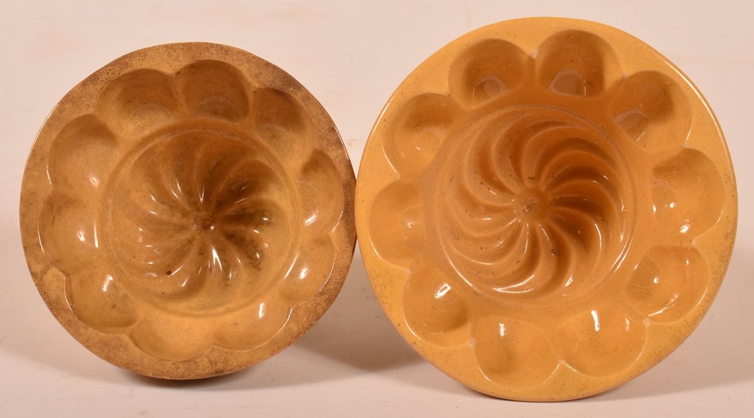Pair of Yelloware Swirl Food Molds-5" and 4 1/4" in: Pair of Yelloware Swirl Food Molds-5" and 4 1/4" in Diam. Condition: Light wear and staining
