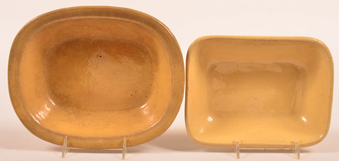 Pair of Yelloware Baking dishes-First 8 3/4 x: Pair of Yelloware Baking dishes-First 8 3/4 x 11"-Second 8 1/2 x 7" and Retains Very Unusual Foot Pads. Condition: Light Staining and Wear