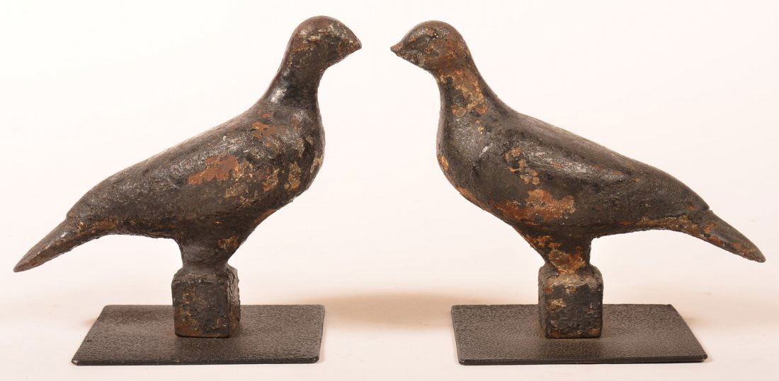 Pair of Dove Form Cast Iron Wind Mill Weights.: Pair of Dove Form Cast Iron Wind Mill Weights. Life size full body cast figures mounted on a later iron platform. 8"h. Condition: Fair, both have broken beaks, overall rust and pitting.