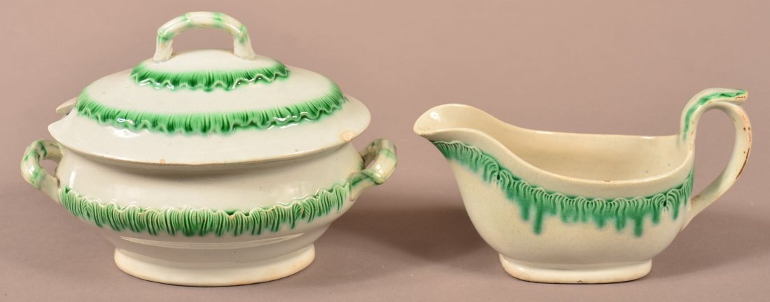 2 pcs. Leeds Green Feather Edge Soft Paste China.: Two Pieces of Leeds Green Feather Edge Soft Paste China. 1st: Covered sauce tureen, 4-3/4"h. 2nd: Sauce boat, 3-3/4"h. Condition: Tureen has one chip on edge of lid, sauce boat has minor glazing wear