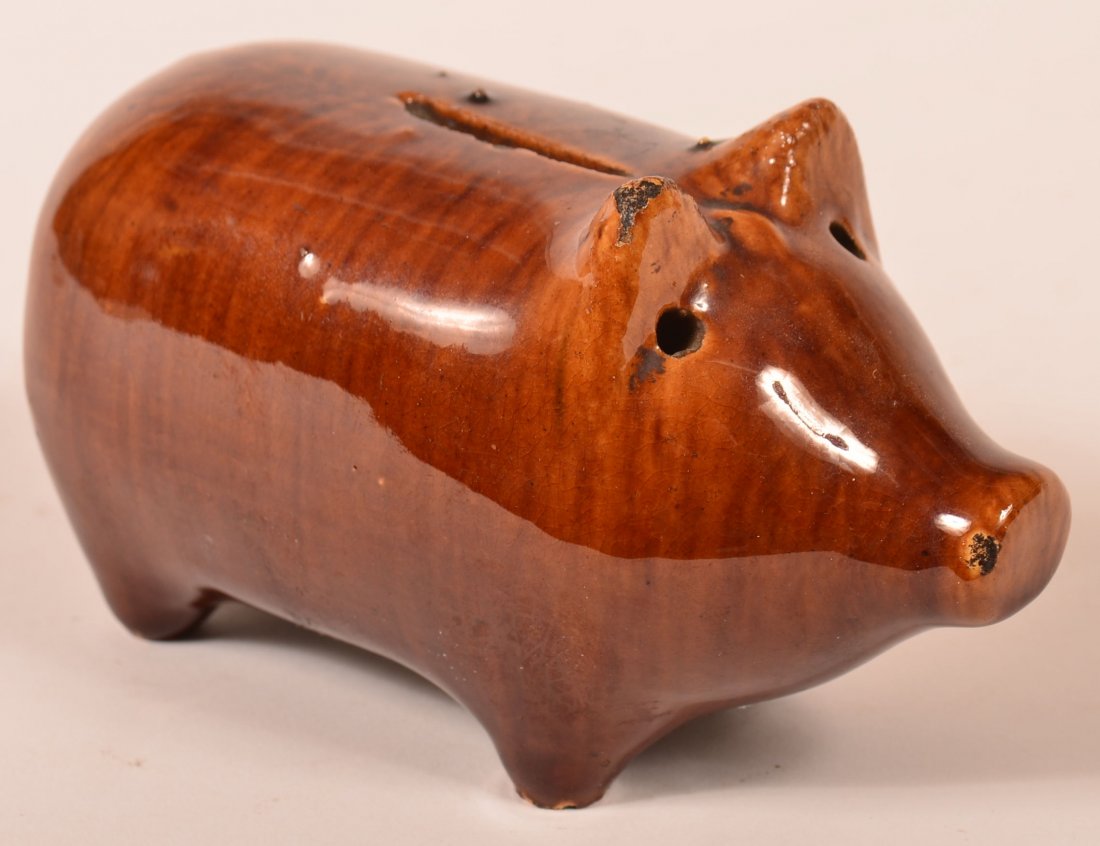 Rockingham Glazed Pottery Pig Form Still Bank.: Rockingham Glazed Earthenware Pottery Pig Form Still Bank. 3-1/2"h. x 6"l. Condition: Good, few small chips.