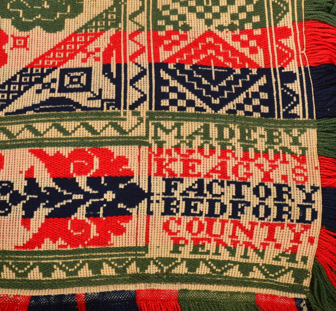 Four Color Bedford County Jacquard Coverlet.: Four Color Bedford County Jacquard Coverlet. Signed "Made by L. Gordon Keagy's Factory Bedford County Penna." floral and geometric patterns in red, green, blue and neutral colors, Circa 1850. 86" x 79
