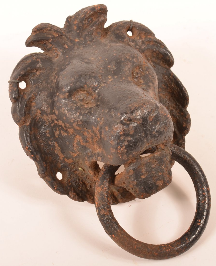 Cast Iron Lion Head Horse Hitch.: 19th Century Cast Iron Lion Head Horse Hitch. Painted black. 10-1/2" l. overall x 8-1/2"w. Condition: Fair, overall rust and pitting.