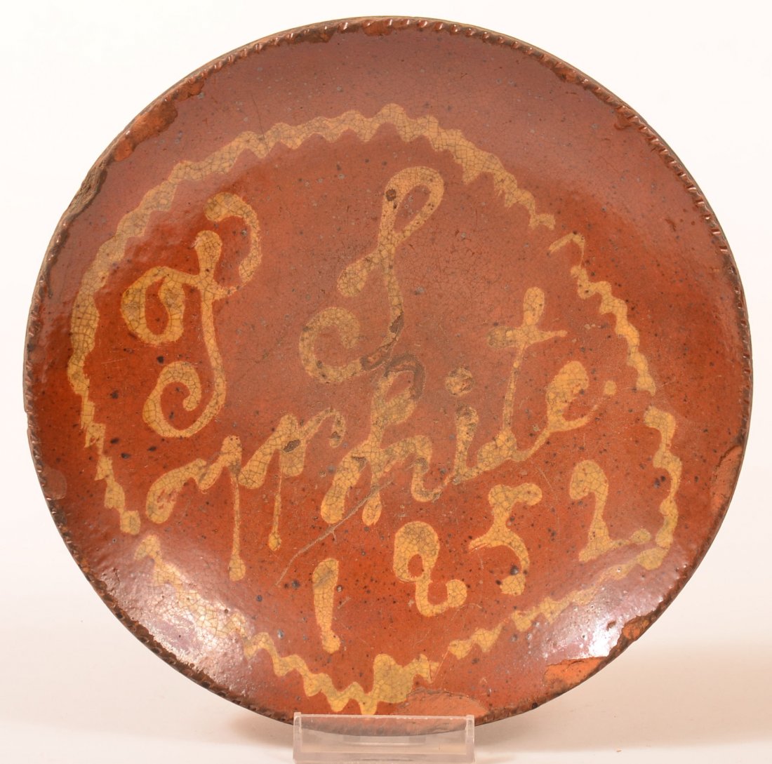 Yellow Slip Script Decorated Redware Plate.: Yellow Slip Script Decorated Redware Pottery Plate "T L White 1852". Coggle wheel edge, zig zag yellow slip border. 7-7/8" diam. Condition: Several edge chips, large flake missing from back.