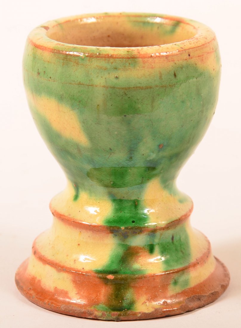 Shenandoah Valley Egg Cup.: Shenandoah Valley Egg Cup with Green and Yellow Mottled Glaze. 3-1/2"h. Condition: Very good, chip on base, glazing wear.