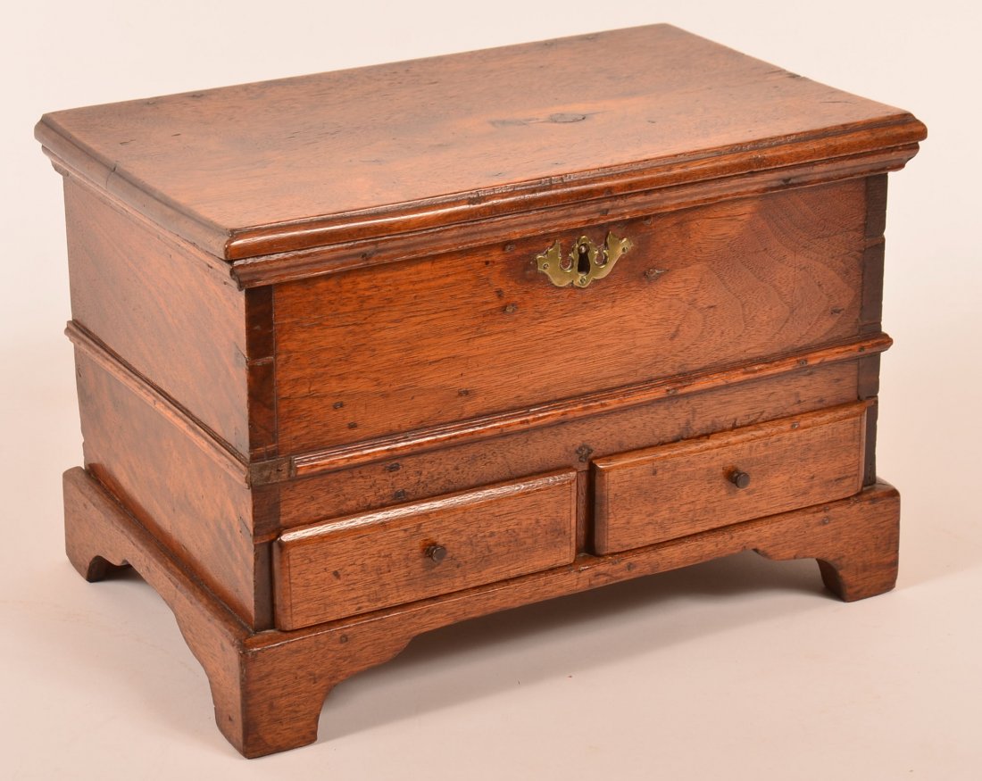 Pennsylvania Miniature Blanket Chest.: Pennsylvania Chippendale Walnut Miniature Blanket Chest. Molded hinged lid, interior box lock, brass bat wing key escutcheon, dovetailed case, molded trim, two split lower dovetailed drawers, shaped b