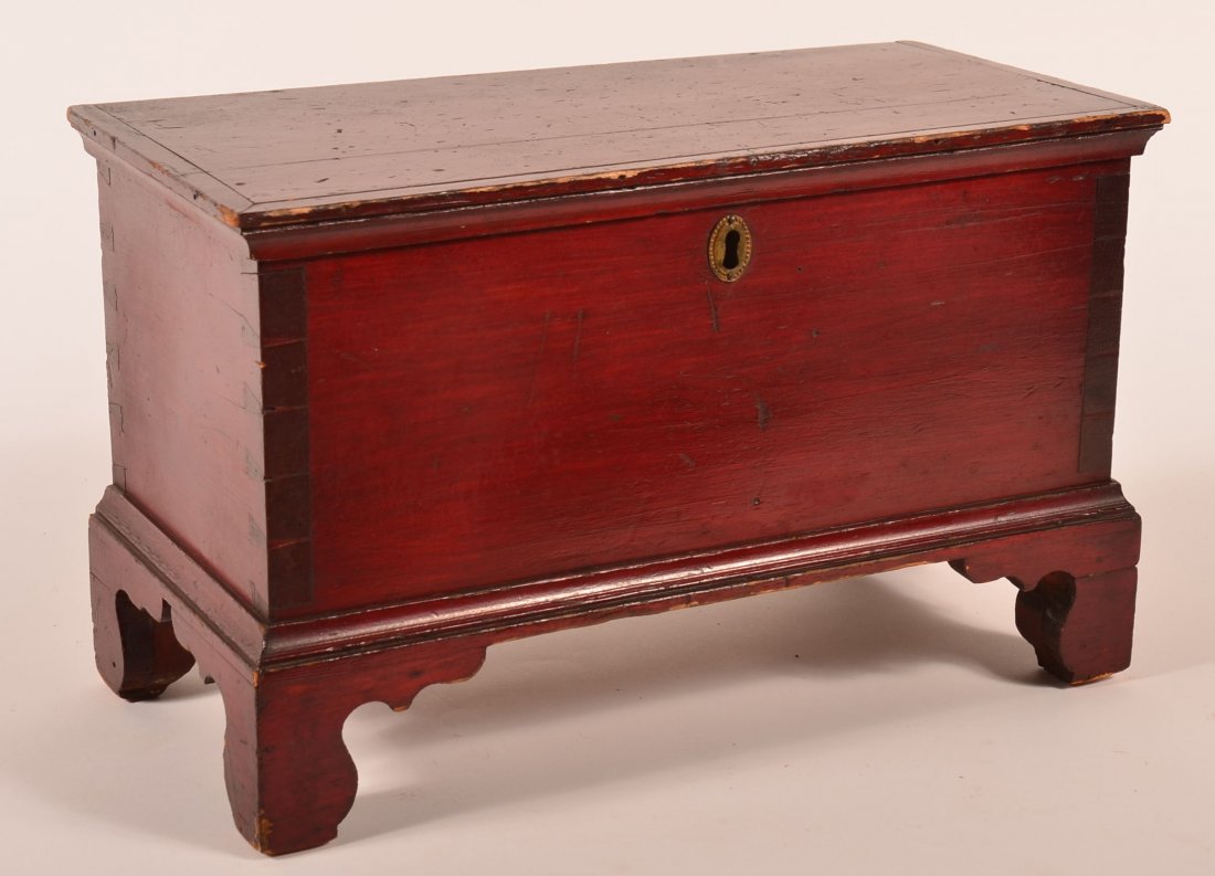 Lancaster Miniature Blanket Chest.: Lancaster County PA 19th Century Miniature Blanket Chest with Original Red Paint. Molded lid, interior till, iron box lock with key, dovetailed case, molded base and high cut-out bracket feet. 10-1/2"