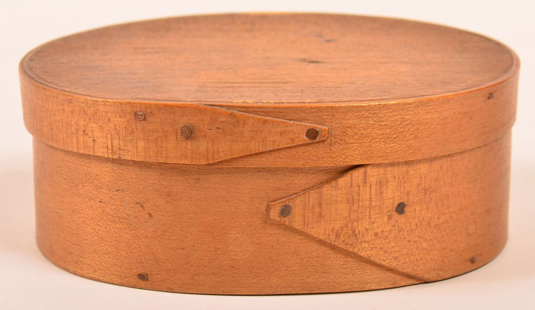 Shaker 19th Century Oval Bentwood Band Box.: Shaker 19th Century Oval Bentwood Band Box. Lapped finger joints with metal tack construction. 2"h x 5-1/4"w x 3-3/4"d. Condition: Very good, minor wear.