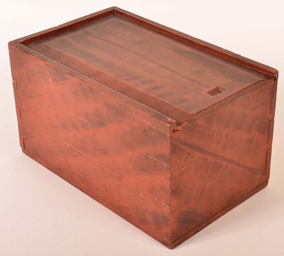 PA Paint Decorated Softwood Candle Box.: Pennsylvania 19th Century Paint Decorated Softwood Candle Box. Original red ground with black grain paint decoration, beveled slid lid and dovetailed case. Square head nail construction on base board.
