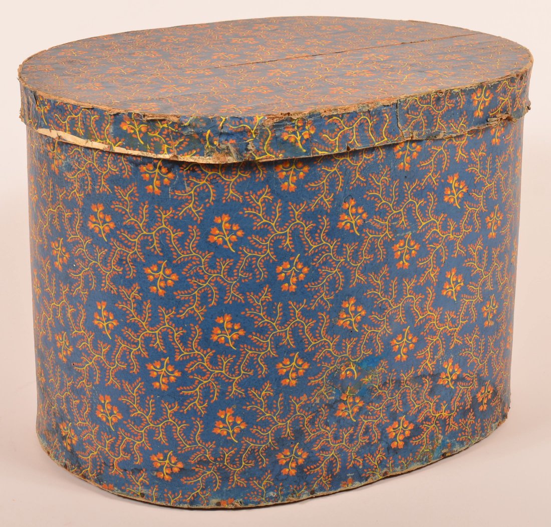 Pennsylvania Large Wallpaper Box: Pennsylvania Early 19th Century Large Wallpaper Box. Bold blue ground with yellow and orange floral and coral branch design, lined with 1841 Lancaster, PA newspaper. 14-1/2"h. x 19-3/4"w. x 14-3/4"d.