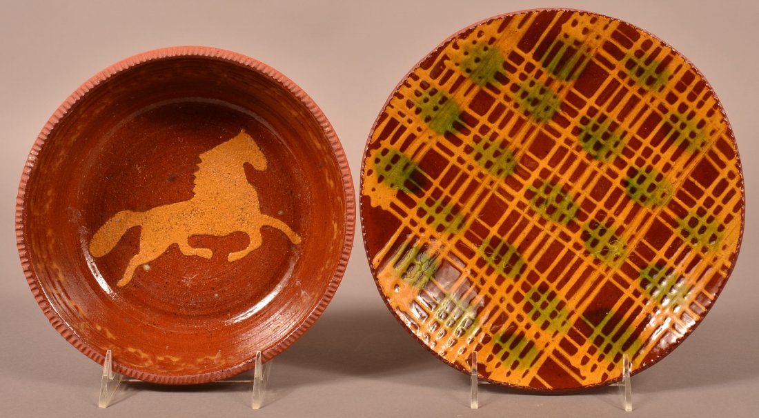 Two C.N. Foltz Redware Pottery Pieces.: Two C.N. Foltz Redware Pottery Pieces. Trotting horse decorated bowl with coggle wheel edge, 8-1.4" diam. And green and yellow slip decorated plate, dated 1980, 9-1/2" diam. Condition: Very good.
