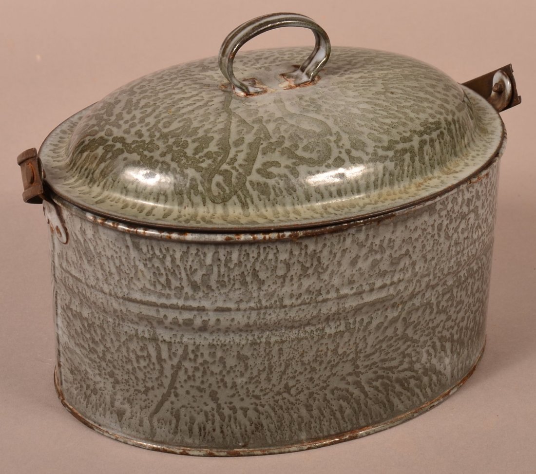Gray Granite Ware Lunch pail.: Gray Granite Ware Lunch pail. Large mottle, oval form with tin swing handle and dome lid. 7-3/4"h. X 10" w. x 7"d. not including handle. Condition: Good, minor and rust.