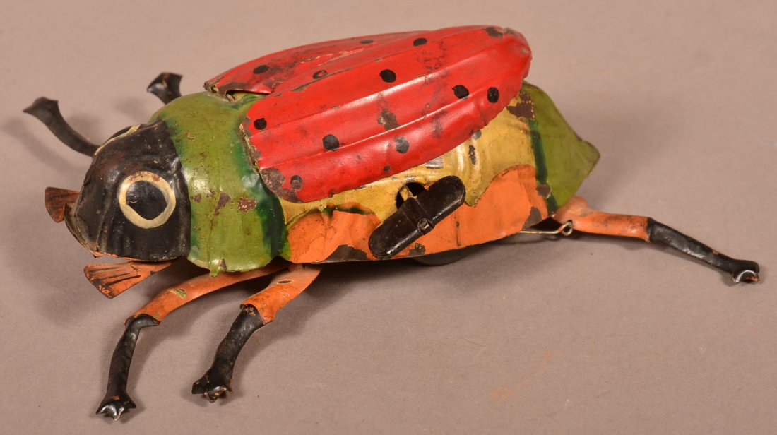 Unsigned German Beetle Tin Wind-up Toy.: Unsigned German Beetle Tin Wind-up Toy. 7-1/2"l. Condition: Good, mechanically sound, old repaint.