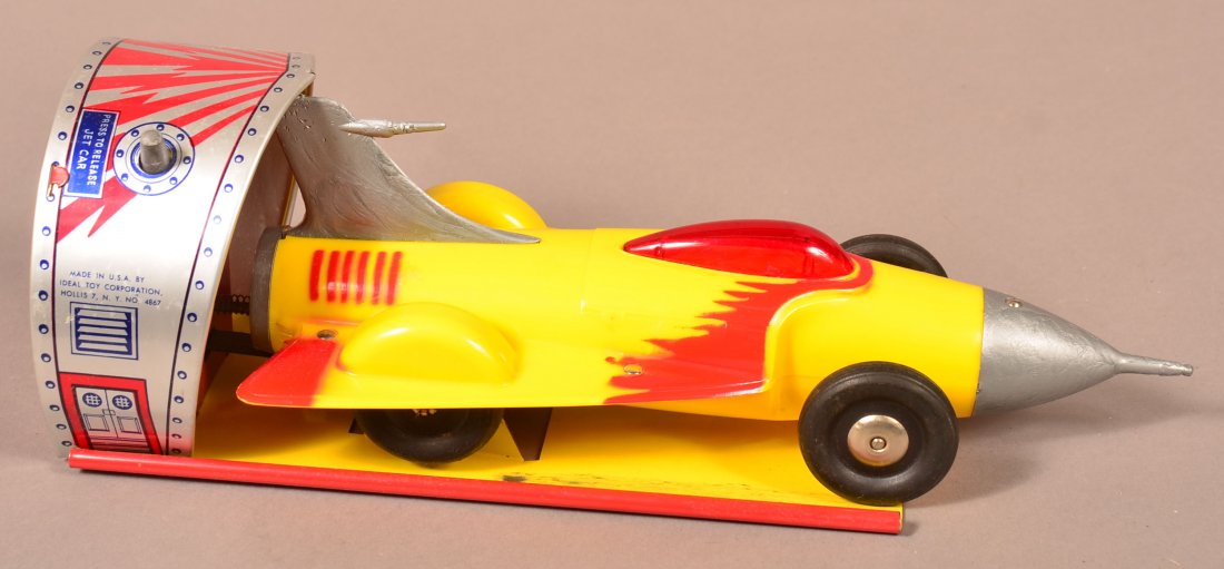 Ideal Toy Corp. Turbo-Jet Car Wind-Up Toy.: Ideal Toy Corp. Turbo-Jet Car Wind-Up Toy. Includes plastic jet car on metal litho launch station. Circa 1950s. 13-1/2" l. Condition: Good with minor wear.