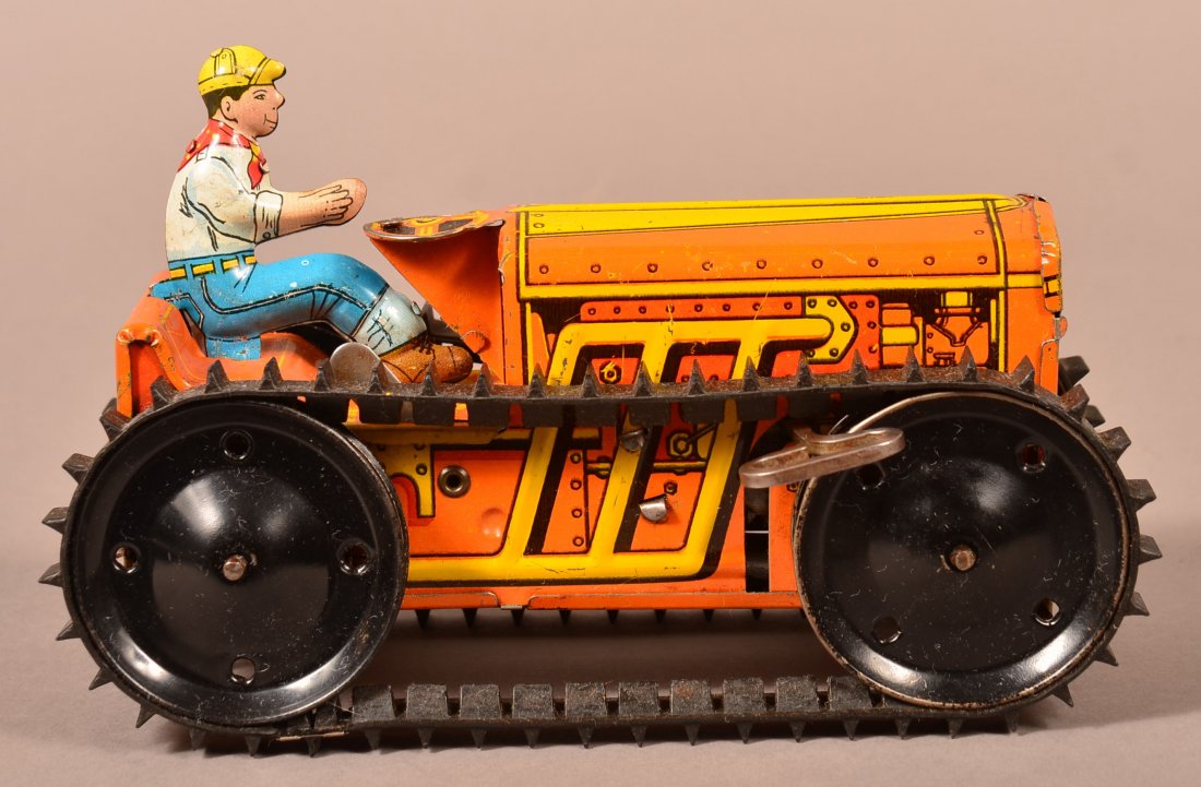Marx Tin Litho Wind-Up Caterpillar Climbing Toy.: Marx Tin Litho Wind-Up Caterpillar Climbing Toy Circa 1950's. Original driver and treads. 8-3/4"l. Condition: Good with minor scratches, missing plow.