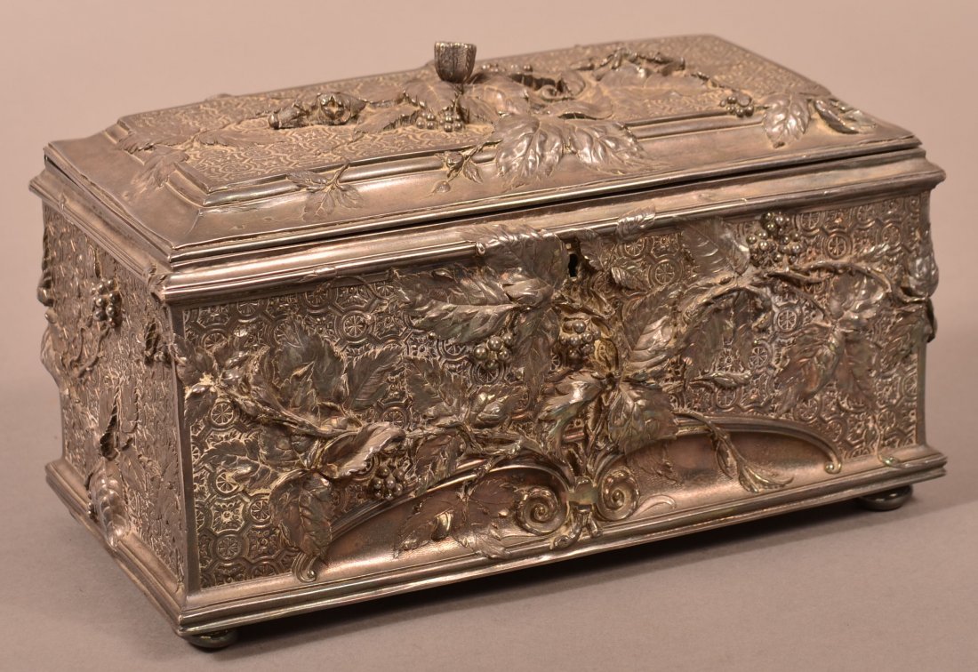 Unsigned Silverplate Jewelry Chest.: Unsigned 19th Century Silverplate Jewelry Chest. Ornate embossed berry and foliate design on a trellis ground. 6-3/4"h. x 11"w. x 5-3/4"d. Condition: Very good with tarnish, felt lining missing on ins