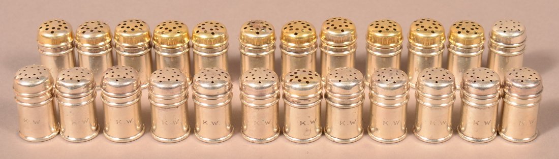 24 Gorham Sterling Salt and Pepper Shakers.: 24 Gorham Sterling Silver Individual Salt and Pepper Shakers. Pepper shakers have gold flash tops. 5.9 troy ozs. 1-1/4"h. Condition: Good with minor wear, monogram KW.
