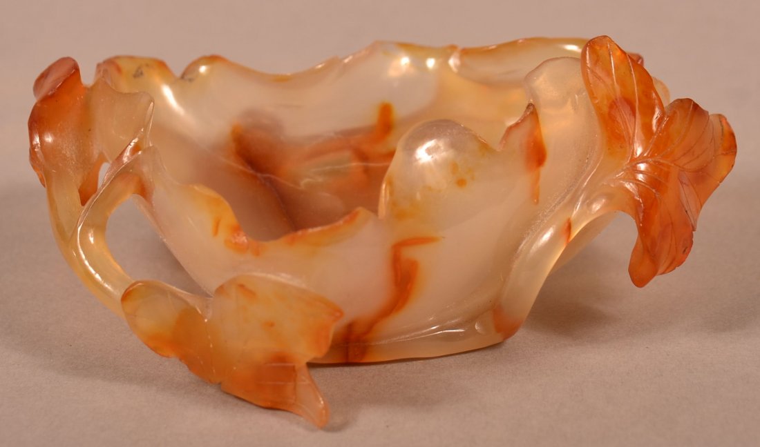 Antique Chinese Carved Agate Lotus Leaf Bowl.: Antique Chinese Carved Agate Lotus Leaf Bowl. Translucent agate in the form of an up-turned leaf forming a bowl with branch and leaf supports. Believed to be used as a brush washer. 4-1/2" long. Condi