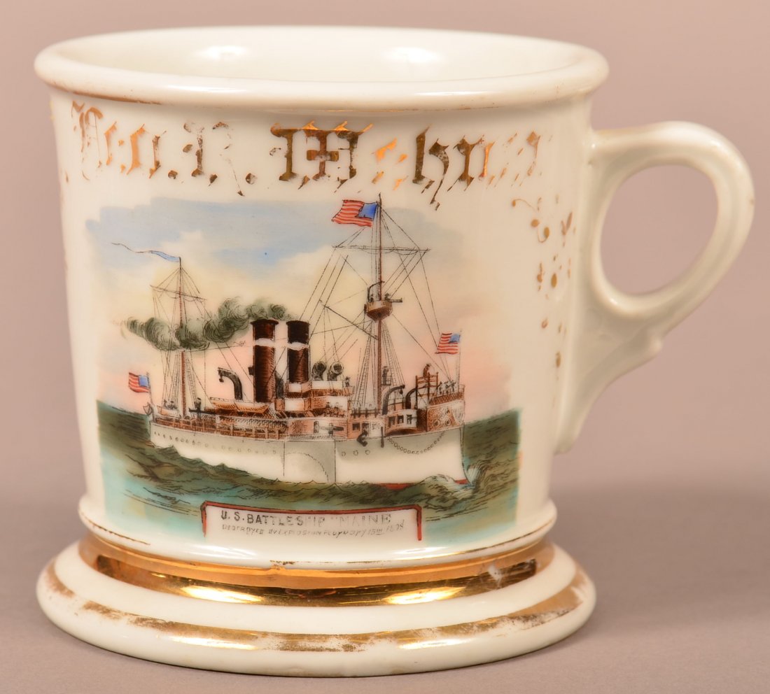 US Battle Ship Maine Porcelain Shaving Mug.: US Battle Ship Maine Porcelain Shaving Mug. Named to Geo. R. Mehner. Green Limoges France mark on base with St Louis retailers mark. 4"h. Condition: Good, wear to gilt decoration.