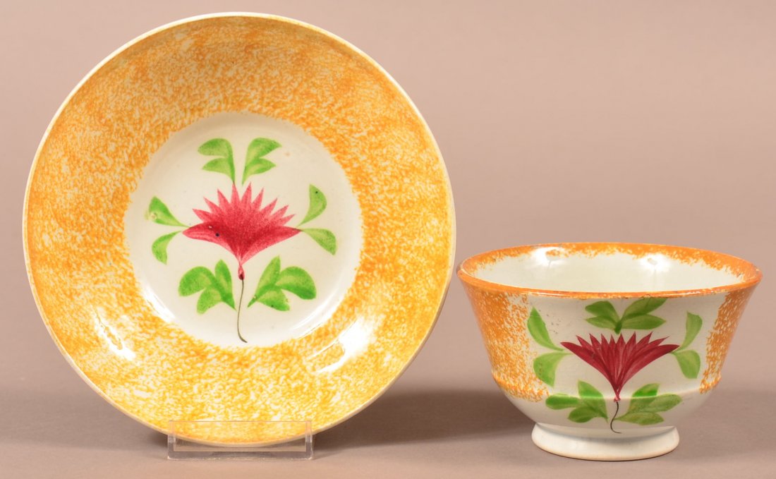 Yellow Spatter Cock's Comb Cup and Saucer.: Yellow Spatter Cockscomb Pattern Cup and Saucer. Red flower with green leaves. Saucer measures 6". Condition: Very good.
