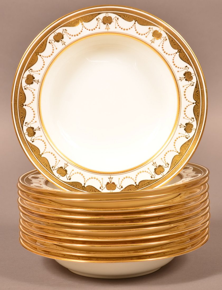 Set of Eleven Minton Porcelain Soup Plates.: Set of Eleven Minton Porcelain Gilt Decorated Soup Plates. Retailed by Gilman Collamore & Co., New York. 9-1/2" diam. Condition: Three have hairlines, remaining are very good.