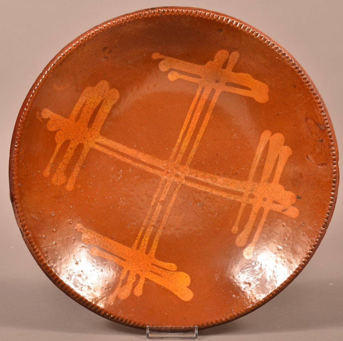 Redware Charger with Yellow Slip Decoration.: 19th Century Redware Charger with Yellow Slip Decoration and Coggle Wheel Edge. 12-3/4" diam. Condition: Professionally restored.