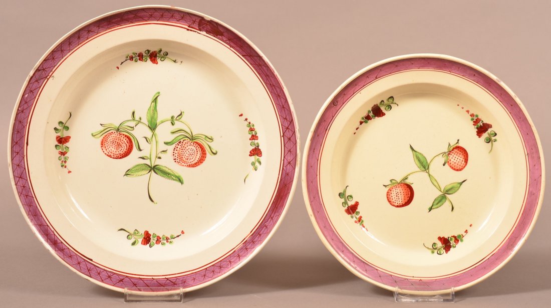Creamware Soft Paste Strawberry Plates: Pair of Creamware Soft Paste Strawberry Plates . 10" and 8 1/4" in diam. Condition: Very good, edge wear to larger plate.