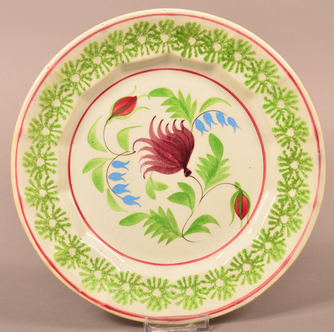 Stick Spatter Columbine Pattern Plate.: Stick Spatter Ironstone China Columbine Pattern Plate. Green no center daisy border. 9-7/8" diam. Condition: Good, glazing has been over sprayed.